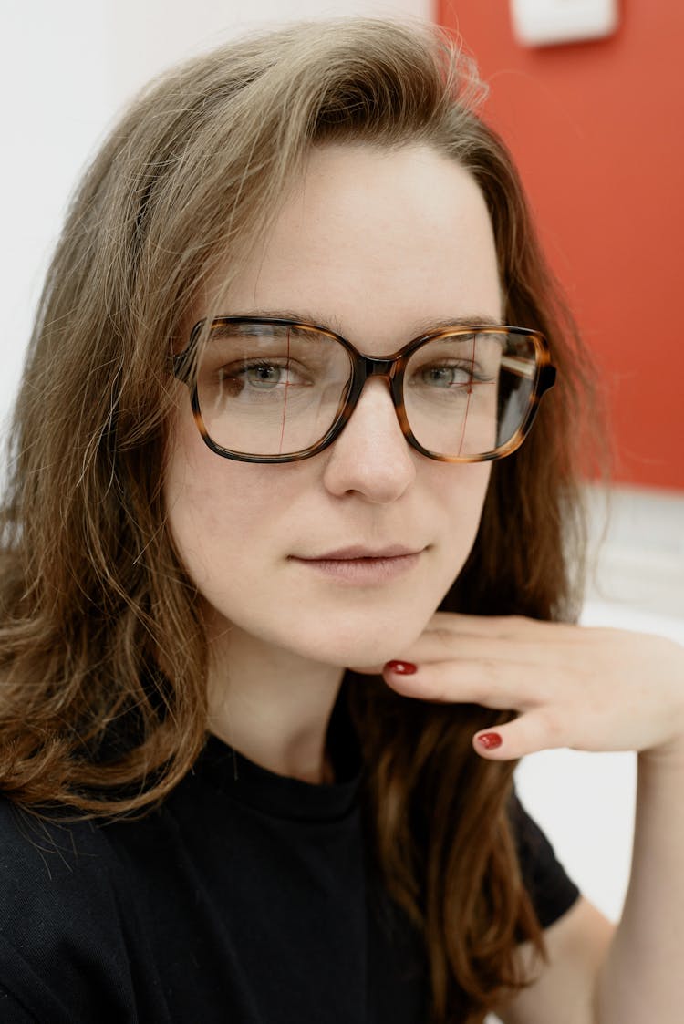 Woman In Modern Eyeglasses With Ornament In Eye Clinic