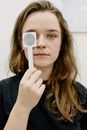 Woman with occluder during eye test in clinic