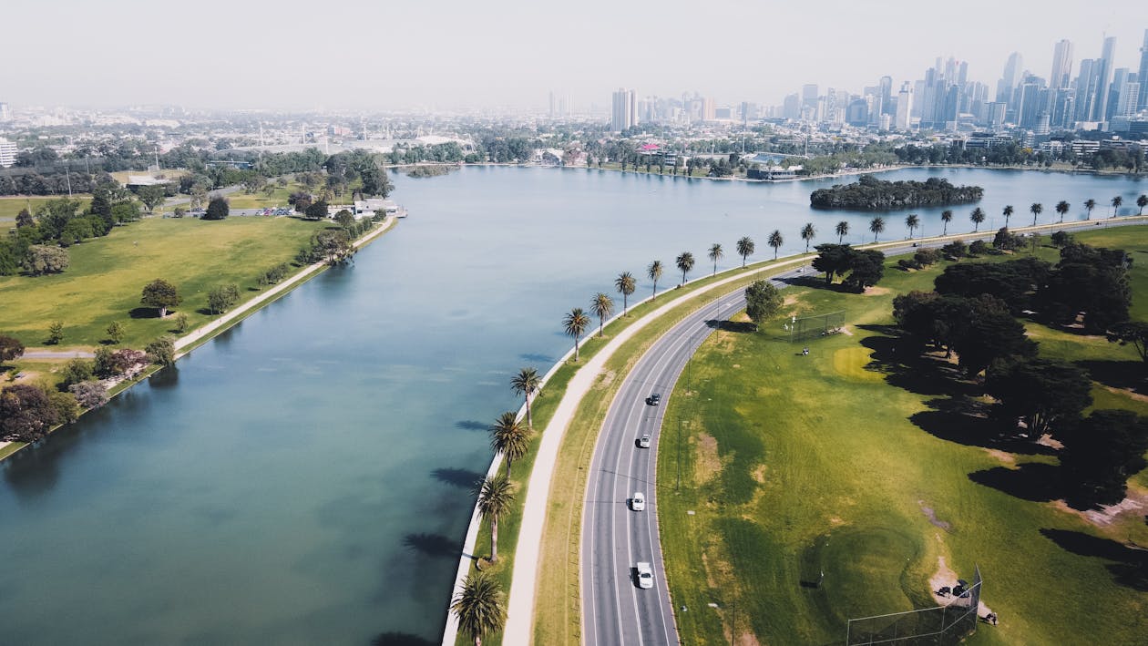 Free Aerial View of Highway Near Body of Water Stock Photo