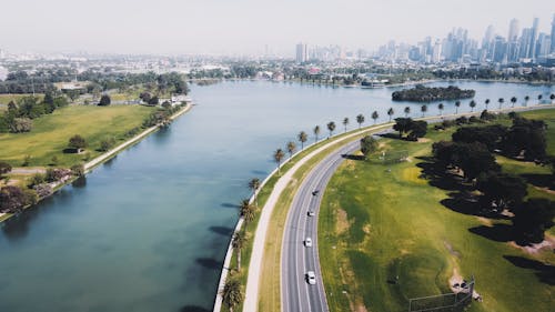 Aerial View of Highway Near Body of Water