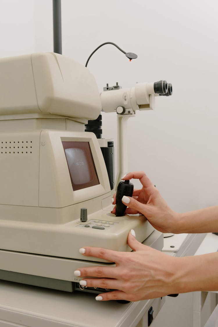 Doctor Working With Topography Machine In Clinic