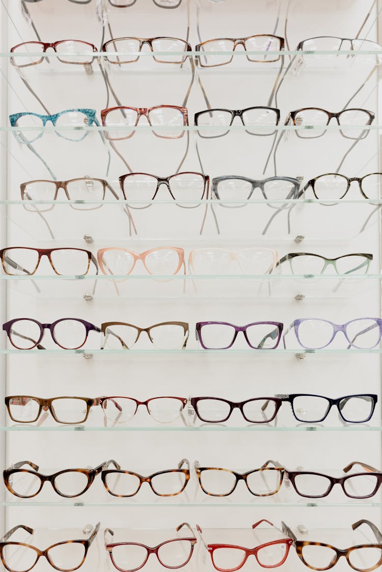 Glasses With Optical Lenses Placed On Shelves