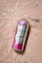 Pink and Silver Bottle on Brown Textile