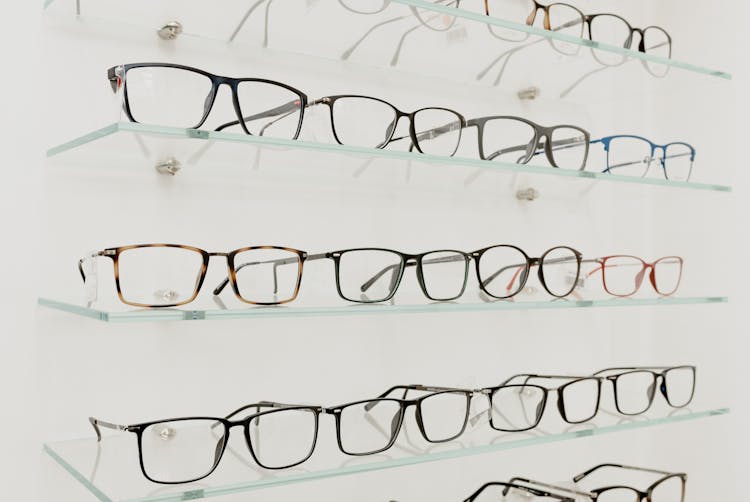 Collection Of Eyeglasses On Shelves In Store