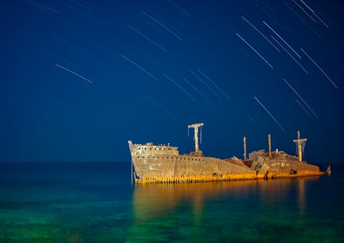 Free 
A Wrecked Ship under a Starry Night Sky Stock Photo