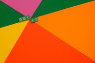 Green Letter Tiles on a Colorful Surface