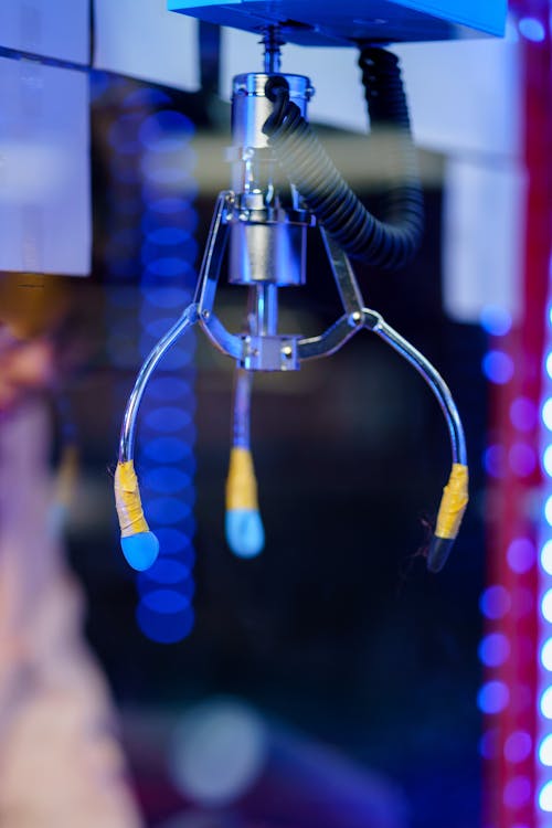 
A Close-Up Shot of the Claws of a Claw Machine