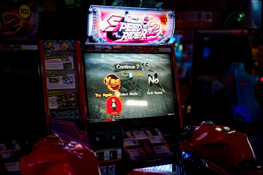 Close-up of an arcade gaming machine screen in a lively amusement center, offering speed racing game options.