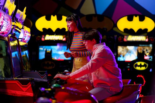 Couple enjoying an arcade gaming night surrounded by neon and Batman decor.
