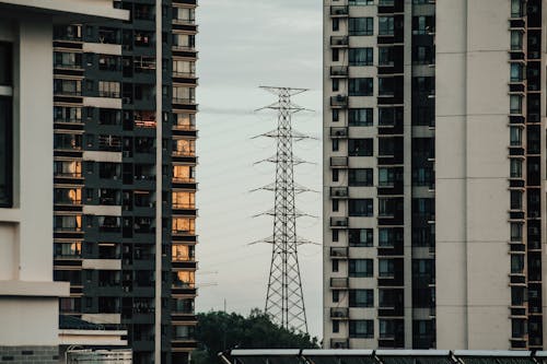 Wire tower between modern multistage residential buildings