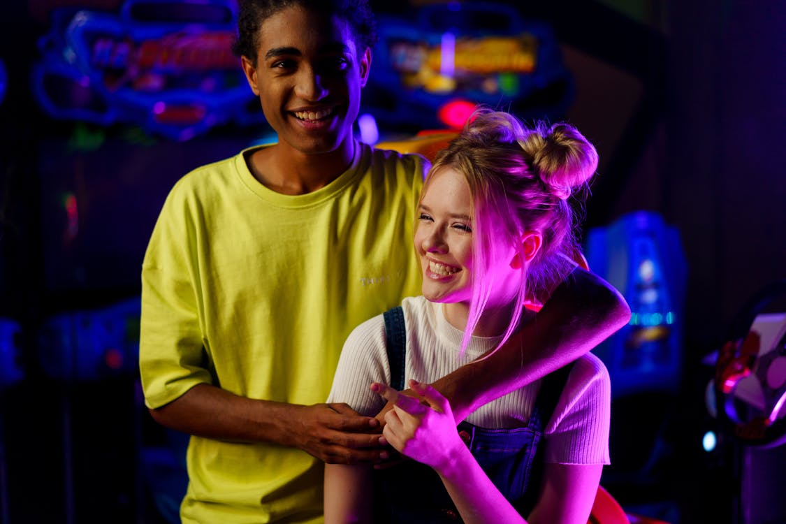 Happy Young Man's Shoulder Wrapped Around  a Woman's Shoulder