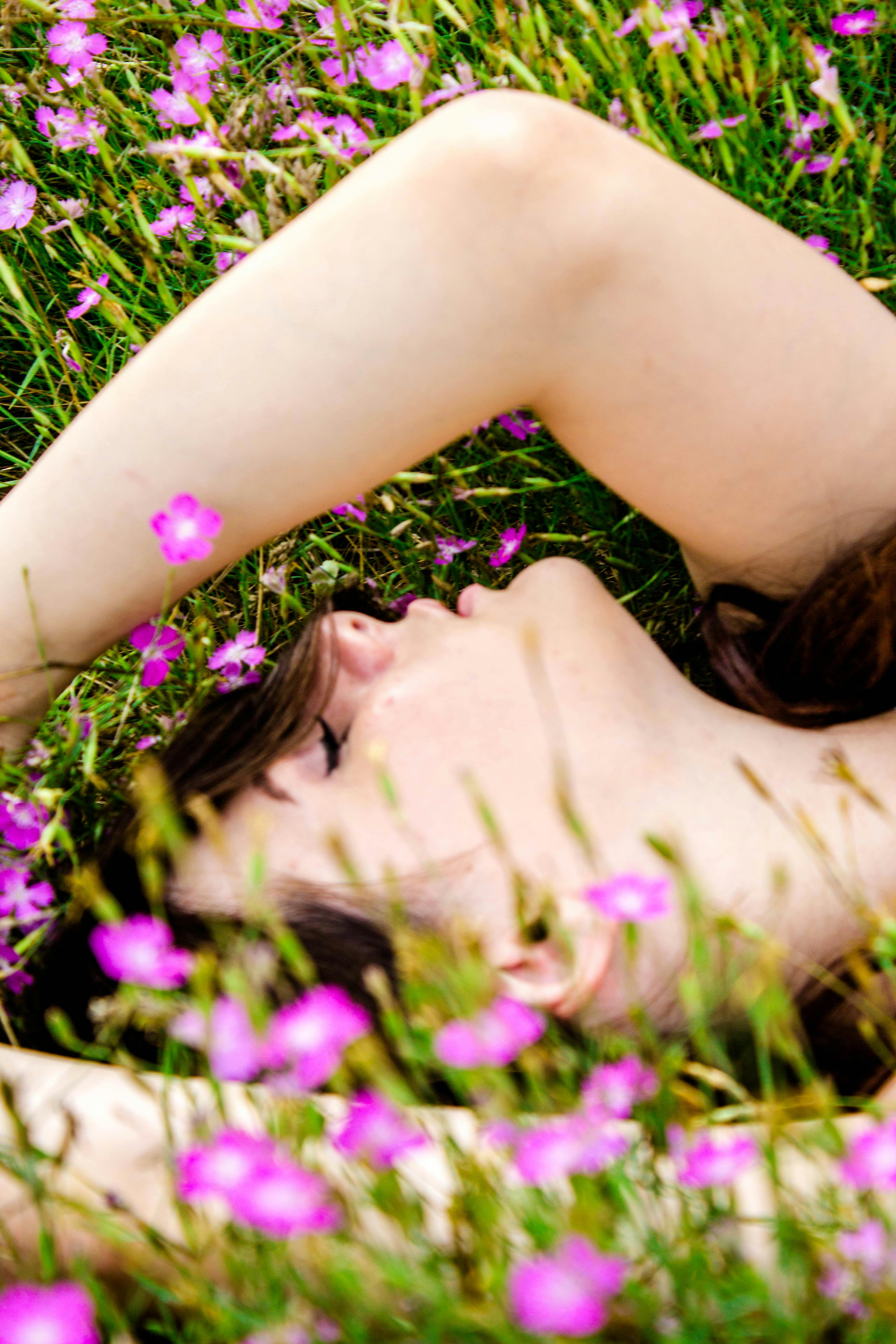 Woman Lying on Flower Field