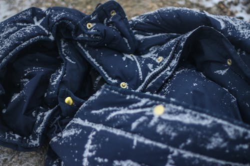 Selective Focus Photography of Blue Zip-up Jacket