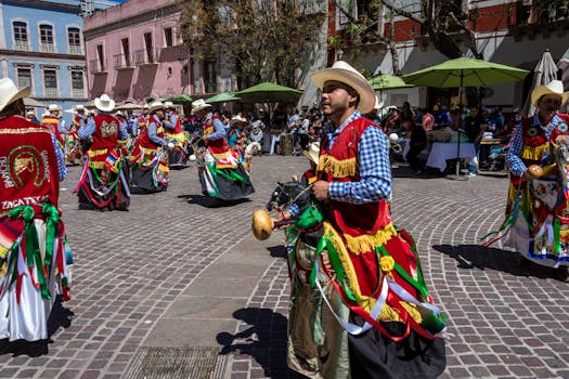 Colorful traditional dancers celebrating Mexican heritage in a lively town square.