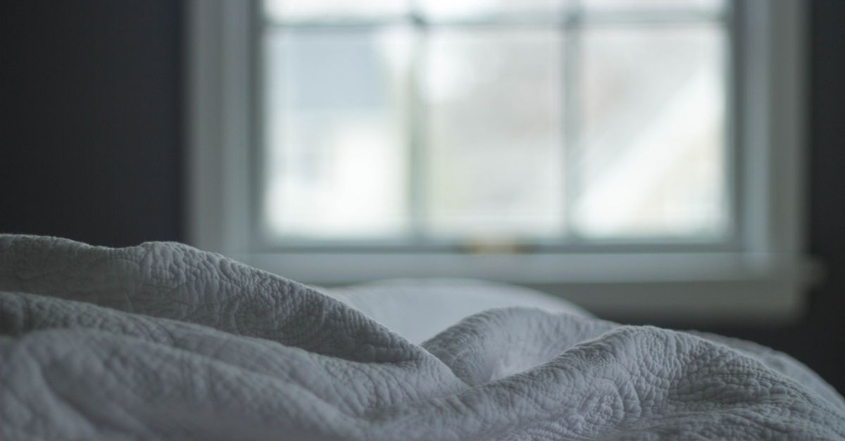 sunrise through bedroom window soft morning light