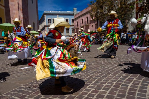 Vivid street performance of traditional dancers in colorful attire celebrating a cultural festival.