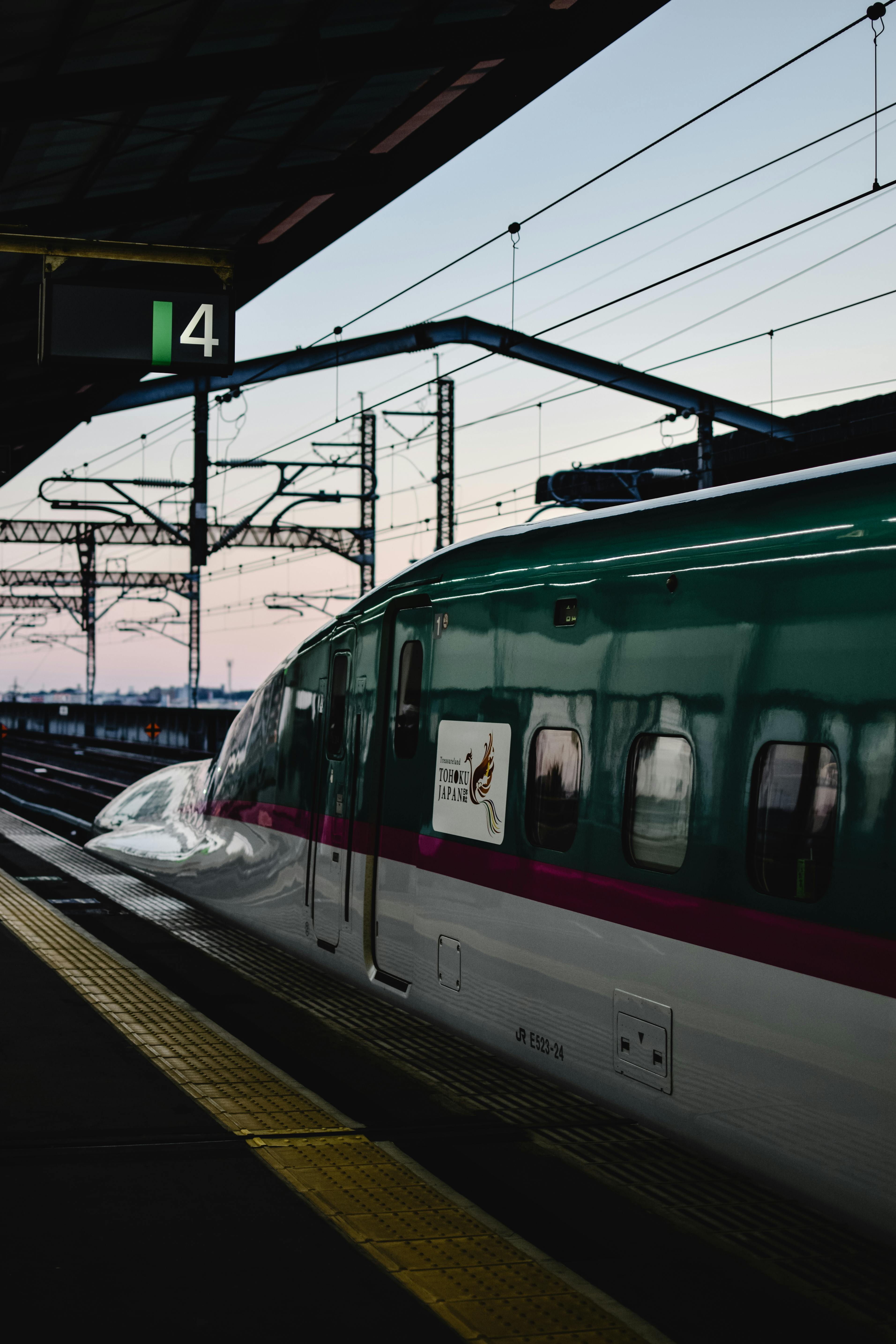 Vertical Shot of a White Bullet Train · Free Stock Photo