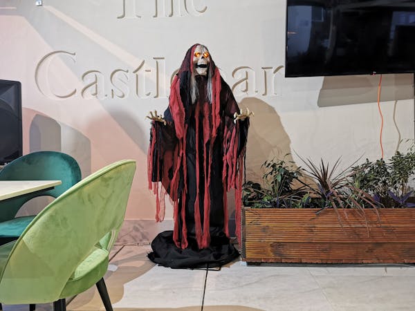 Pest control staff treating eaves on commercial building