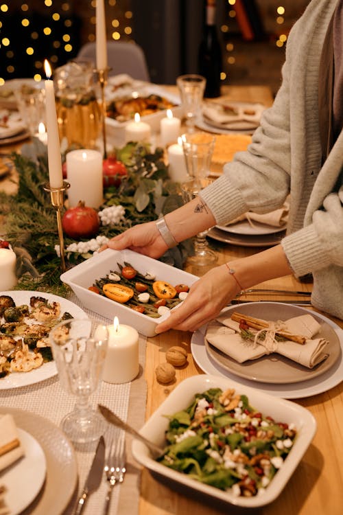 Person Serving a Food for Christmas Dinner