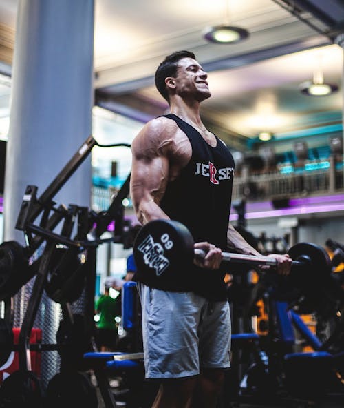 Free Photo of Man Lifting a Barbell Stock Photo