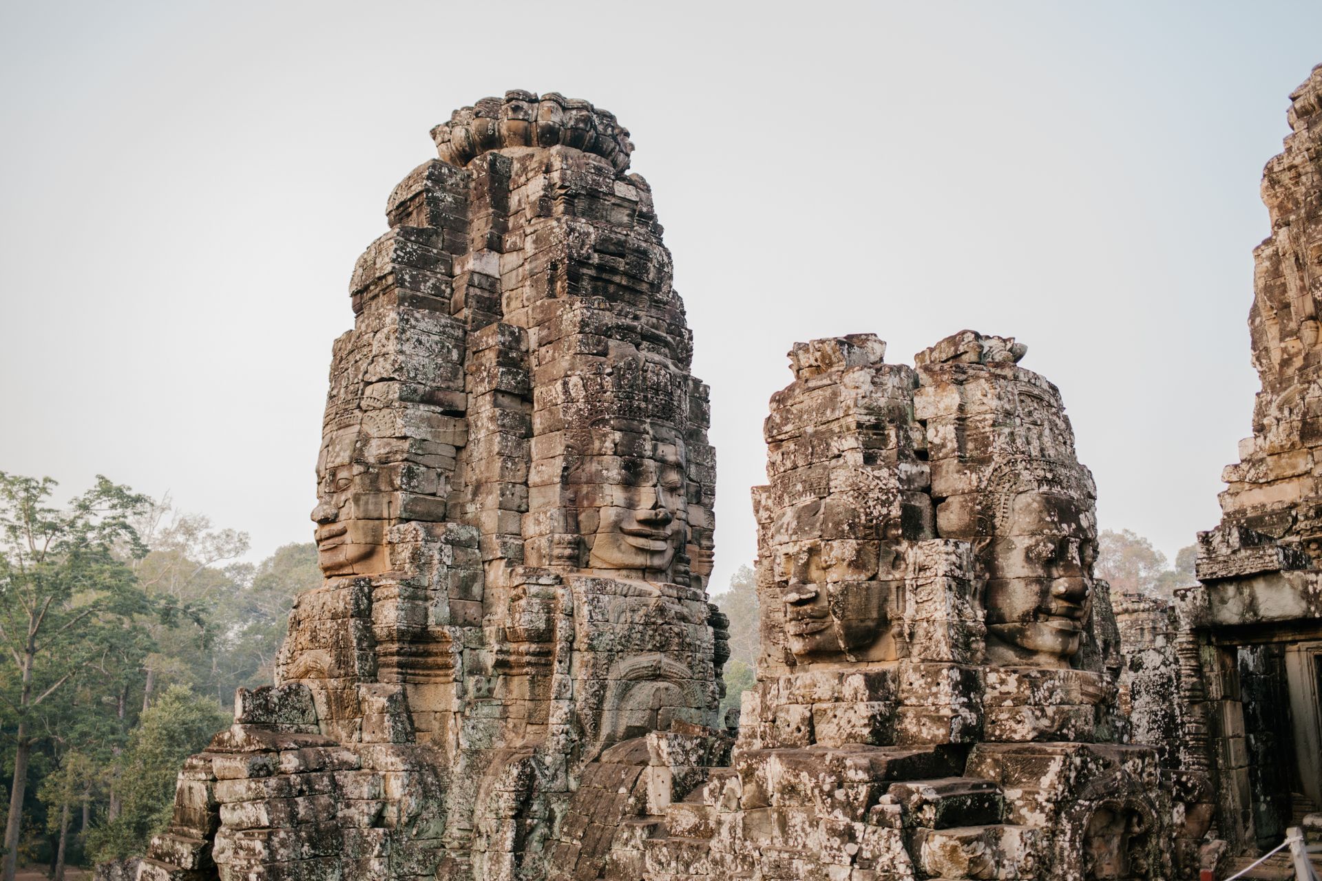Ancient stone faces of the Bayon Temple, Siem Reap, Cambodia — Khmer Empire carvings