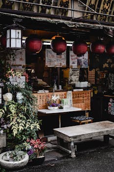 Charming Tokyo shopfront featuring red lanterns and traditional decor, perfect for urban lifestyle themes.