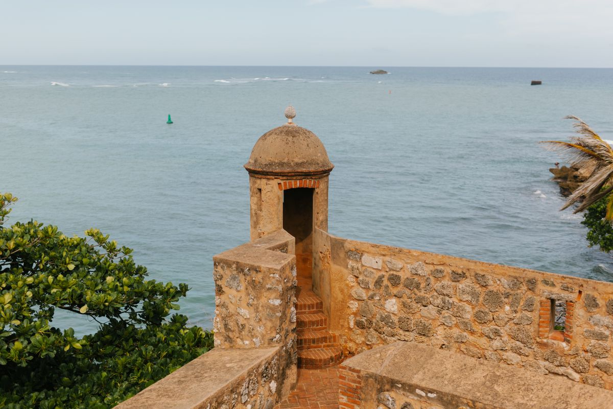 Historic Fortaleza San Felipe overlooking the serene ocean waters in the Dominic