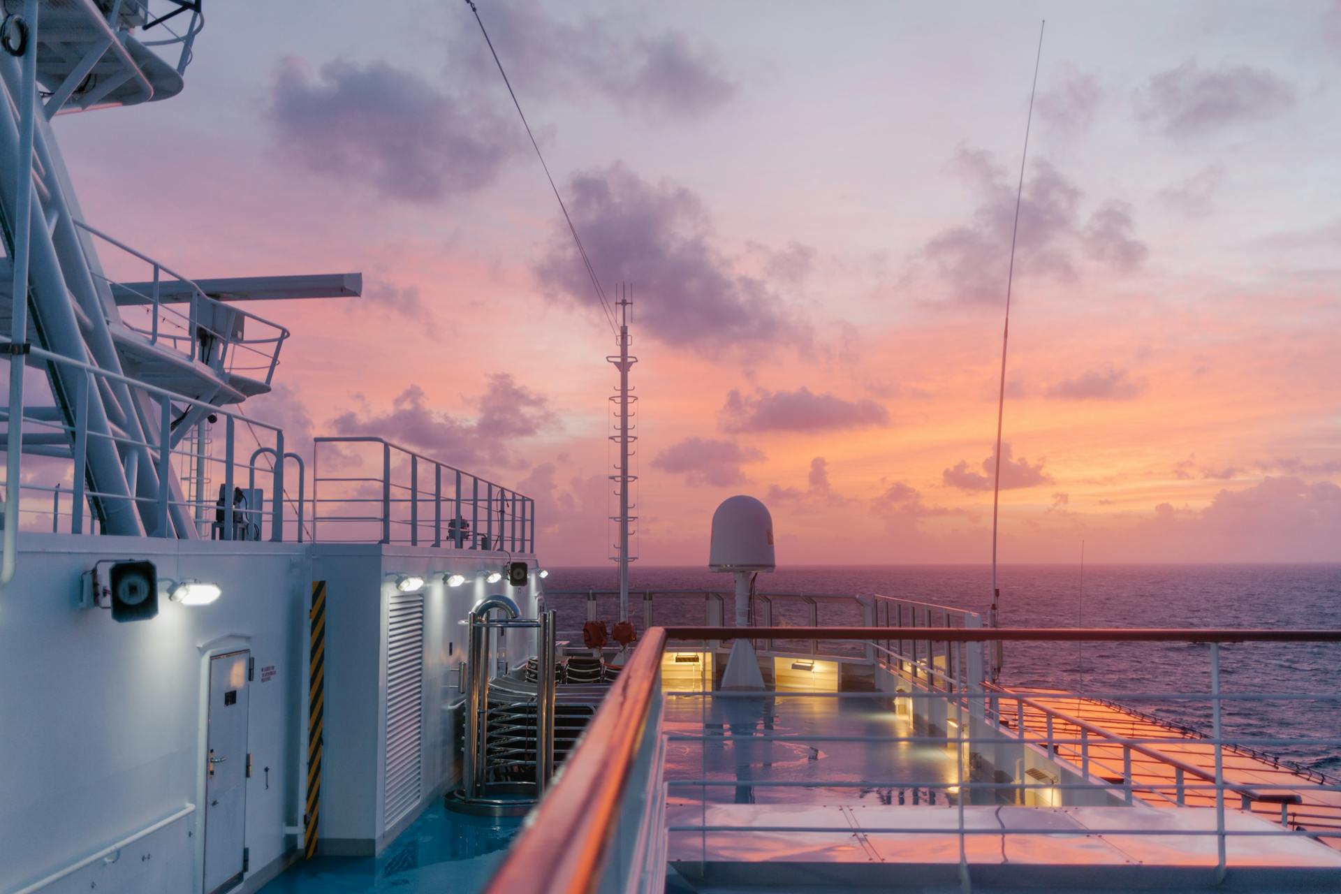 Experience the golden hour on a cruise ship with a serene seascape and stunning sunset.