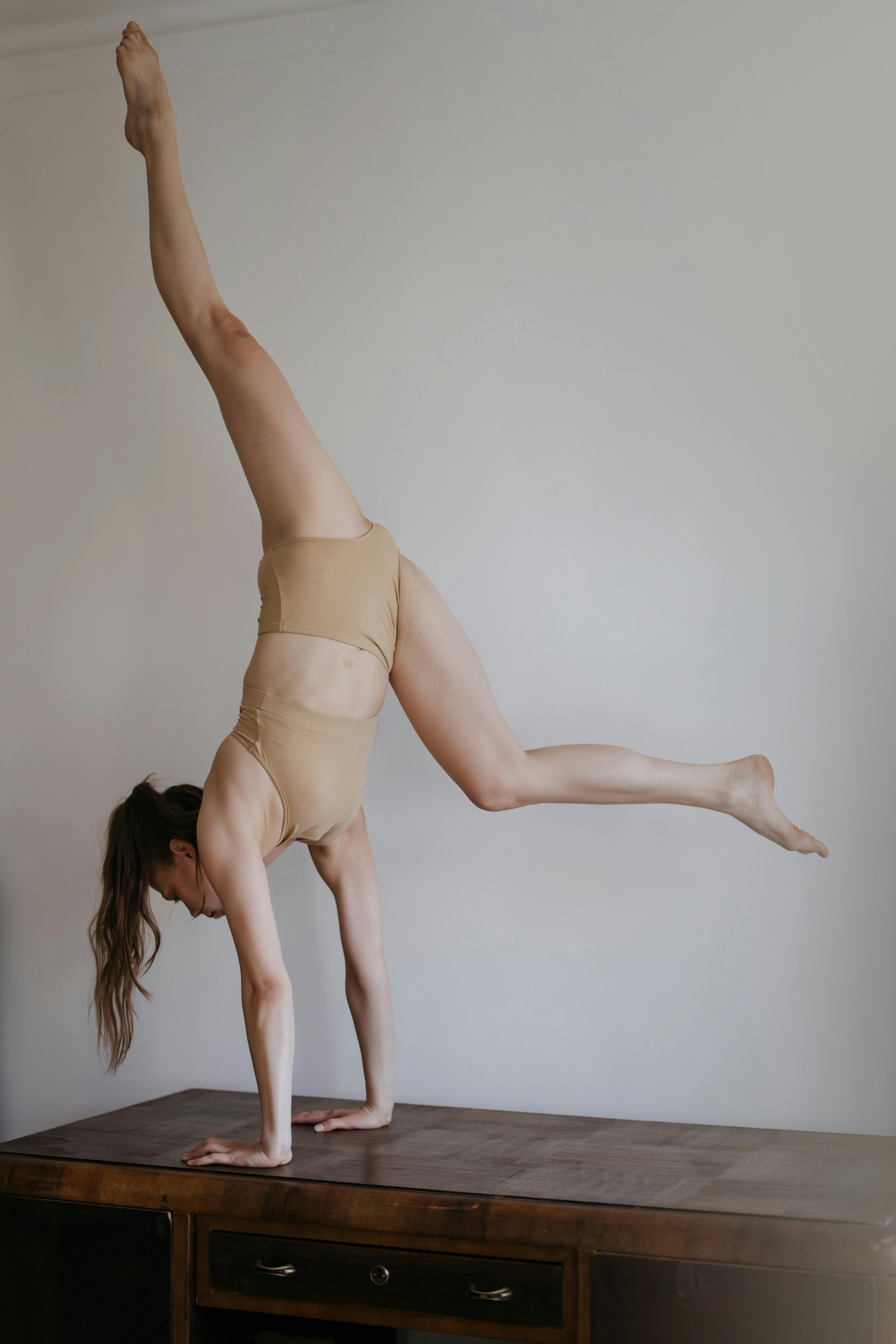 Photo of a Woman Doing Acro Yoga · Free Stock Photo