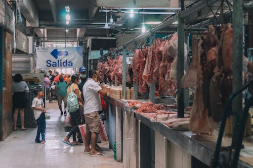 Free Raw Meat Hanging on Stalls Stock Photo
