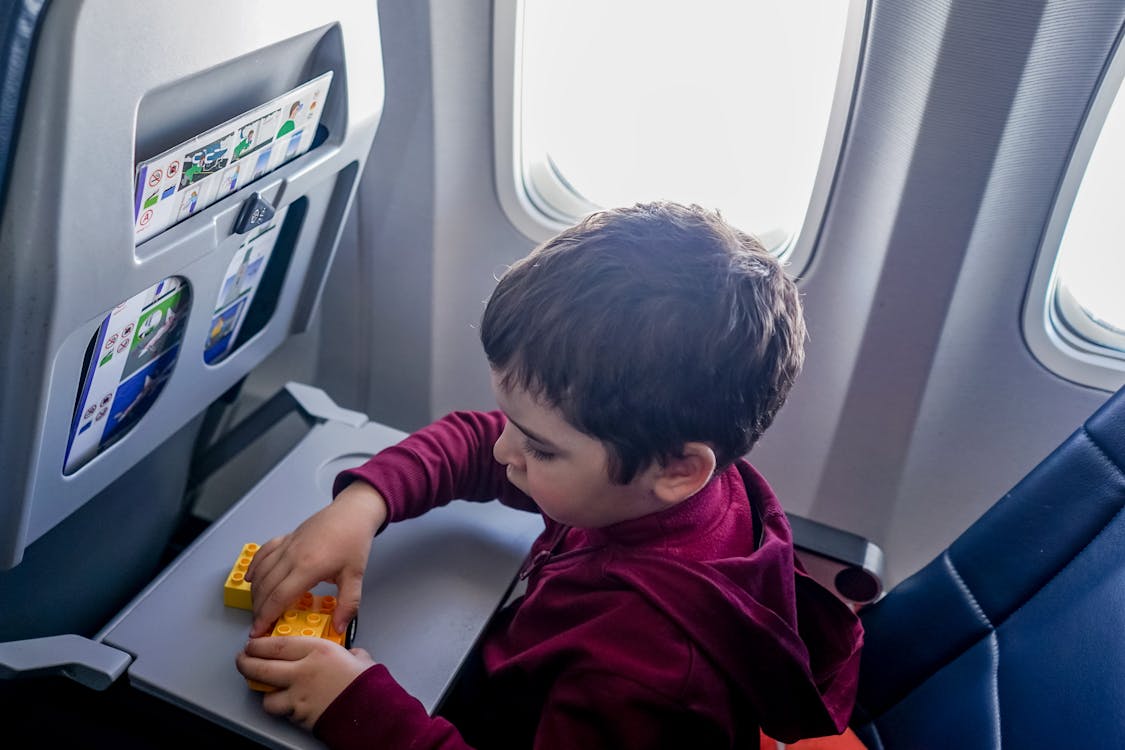 Free Boy playing with toy on plane Stock Photo