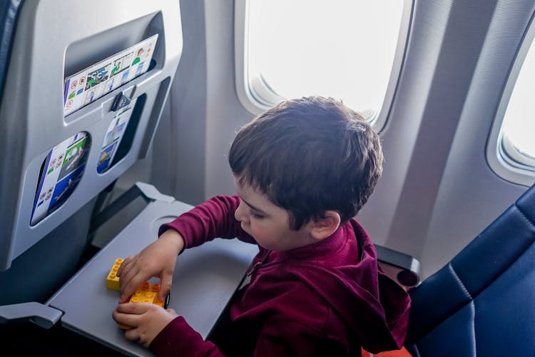 Boy Playing With Toy On Plane