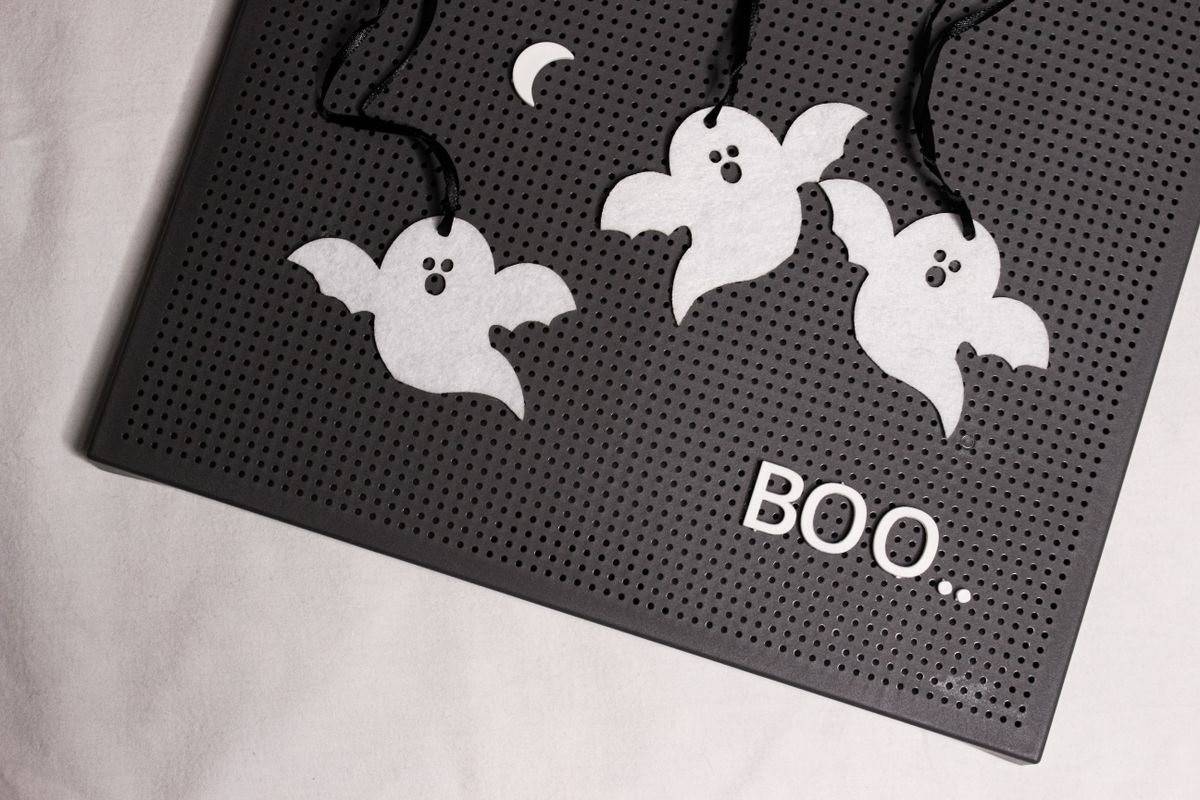 Halloween ghost decorations with a bold BOO sign