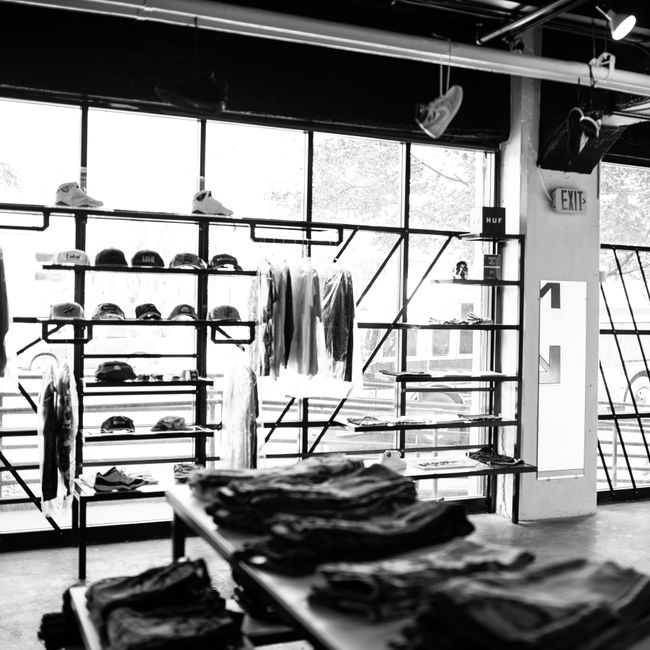luxury clothing store interior with minimalist clothing racks