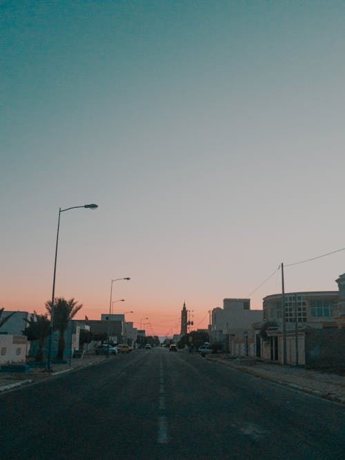 Symmetrical Shot of a City Street at Sunset 