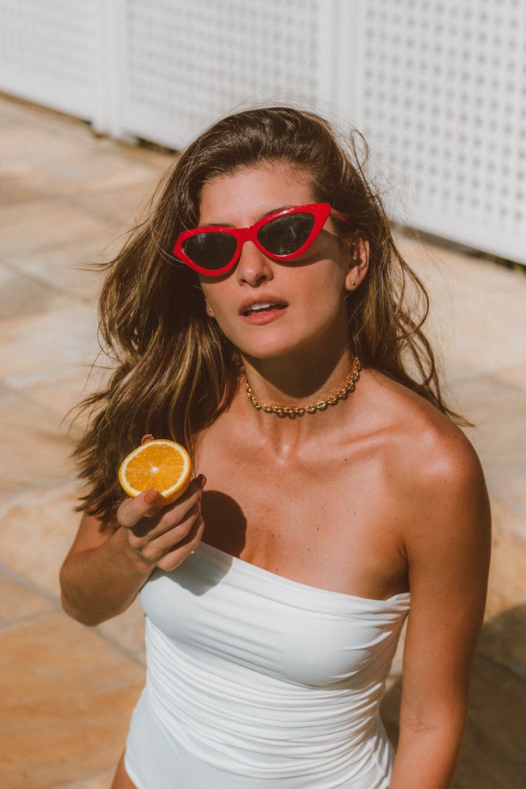 Woman With Orange On Street