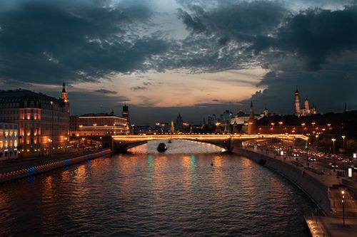 Free Stunning evening view of the Moscow Kremlin and Moskva River captured at sunset. Stock Photo