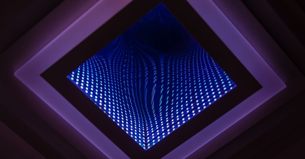 A captivating abstract view of a LED infinity mirror with vibrant light patterns.