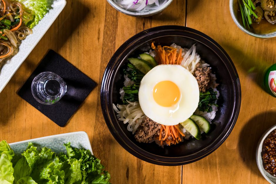 korean groceries rice eggs vegetables on kitchen table