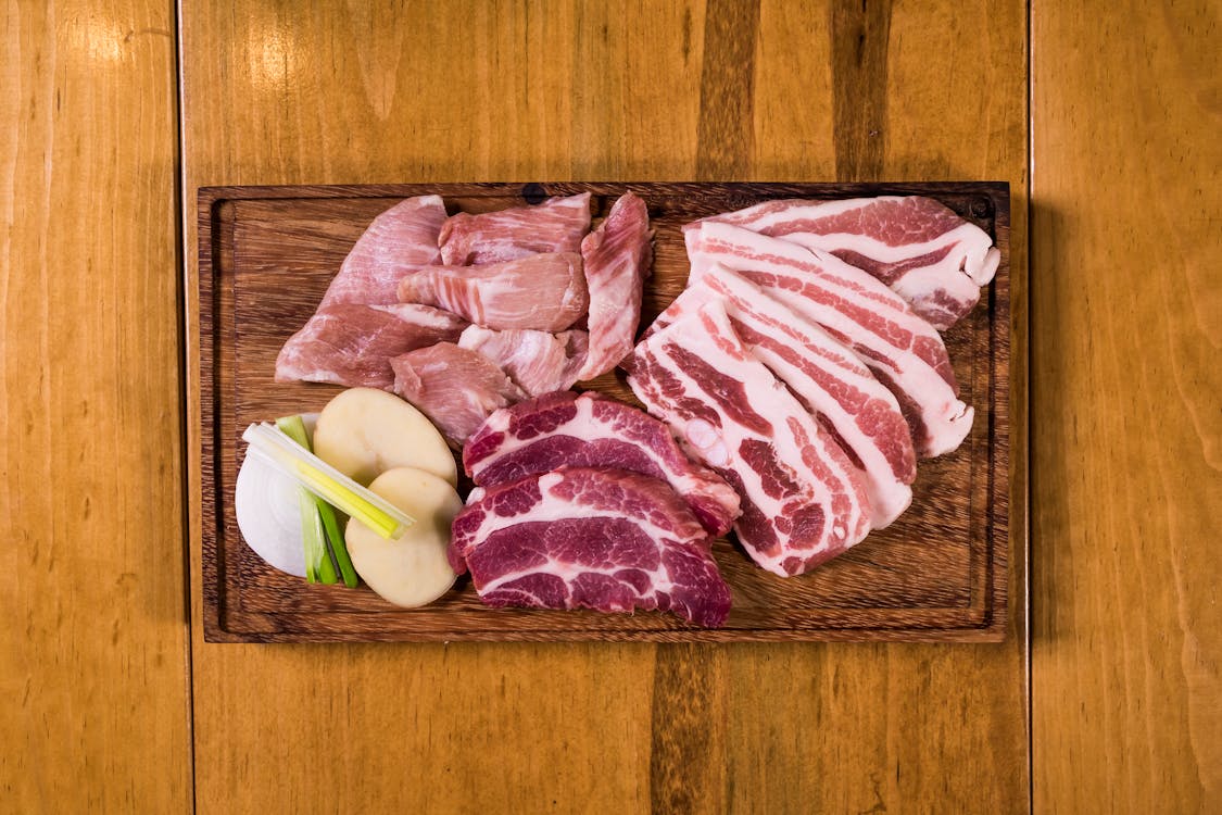 Free Raw Korean BBQ on Wooden Chopping Board Stock Photo