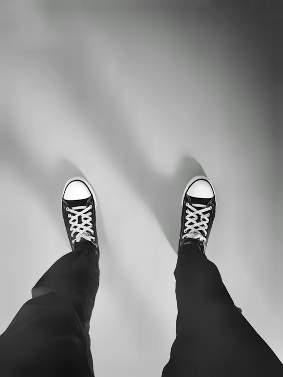 Person in Black Pants and Black and White Sneakers · Free Stock Photo