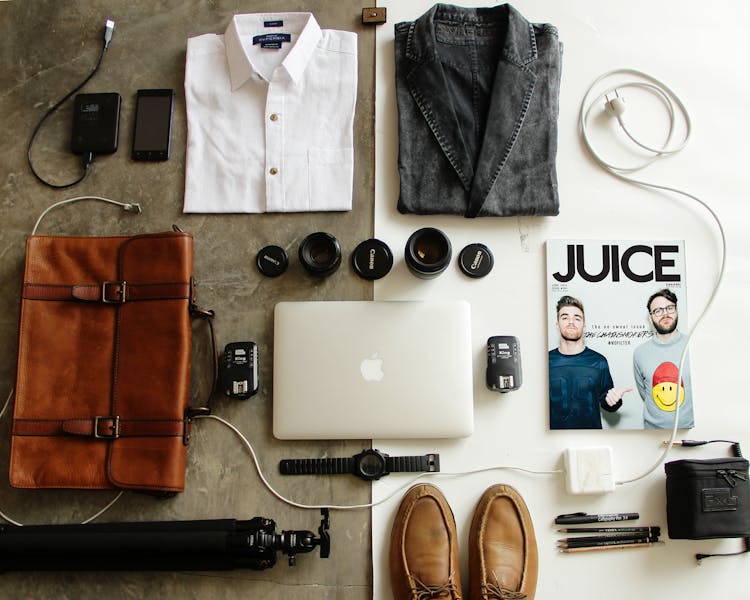 Brown Leather Bag, Clothes, And Macbook