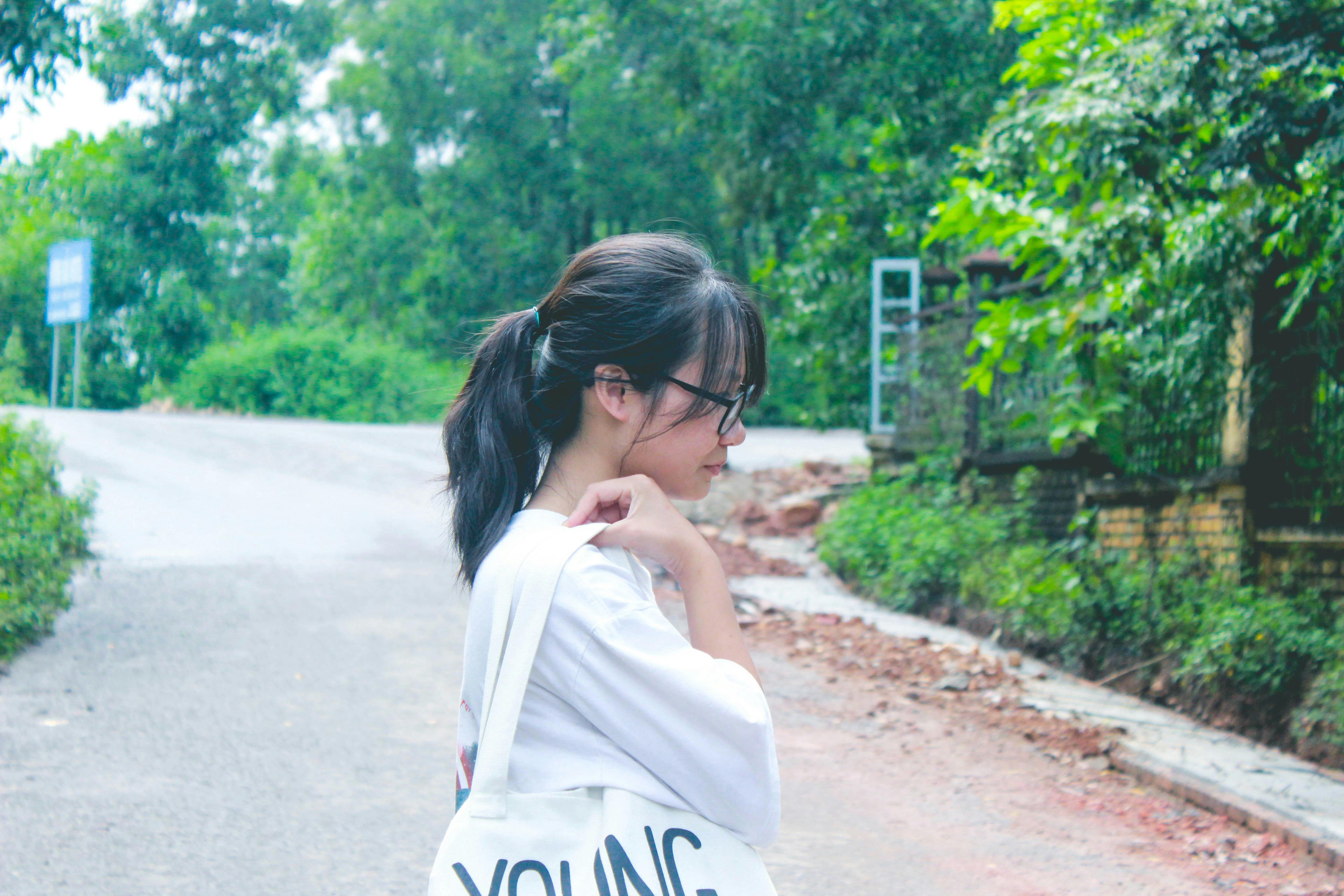 Person using a laptop unplugged outdoors, suggesting long battery life