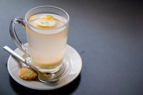 Photo Of Clear Glass With Floating Sliced Lemons