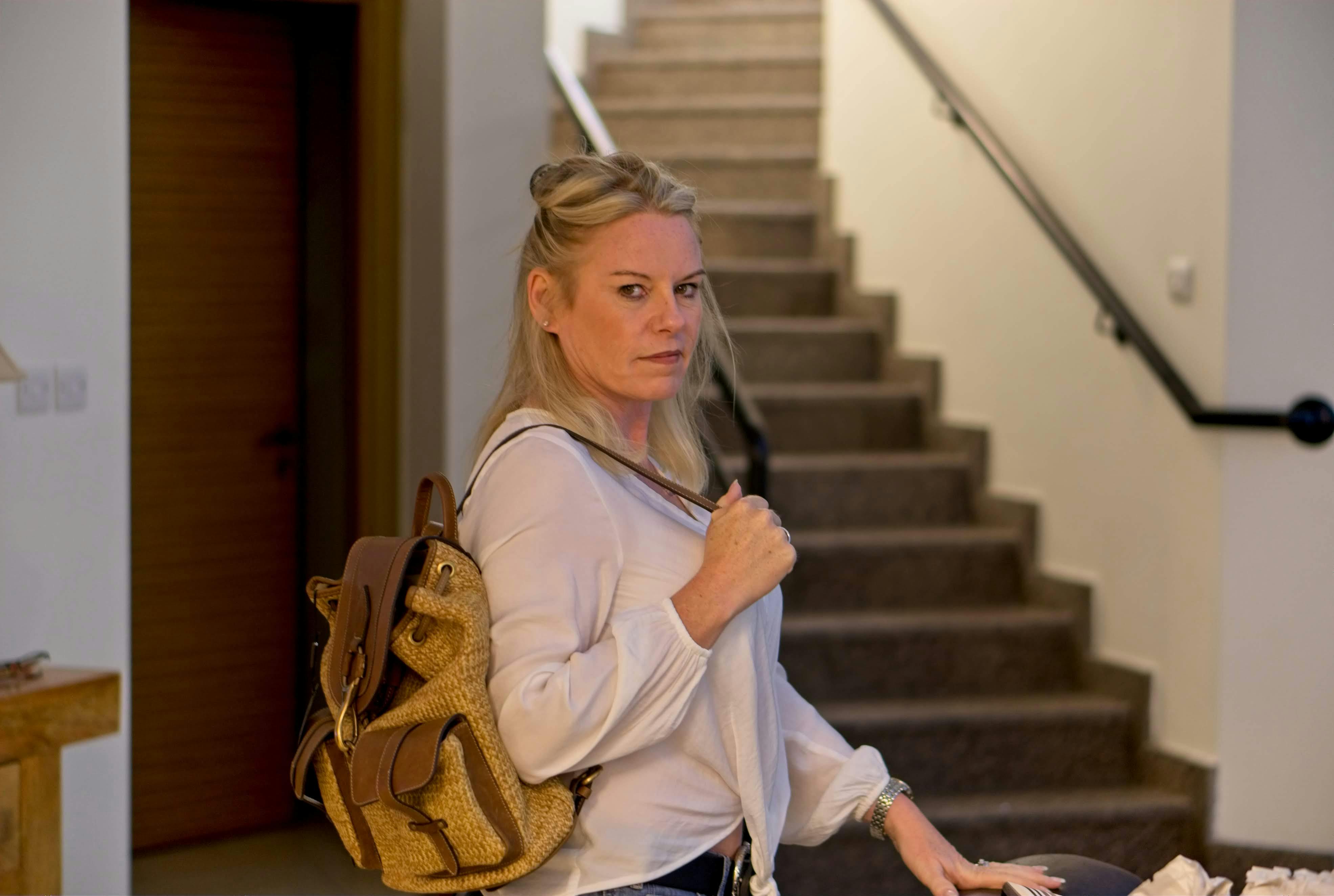 Multiple computer screens showing different AI tool interfaces