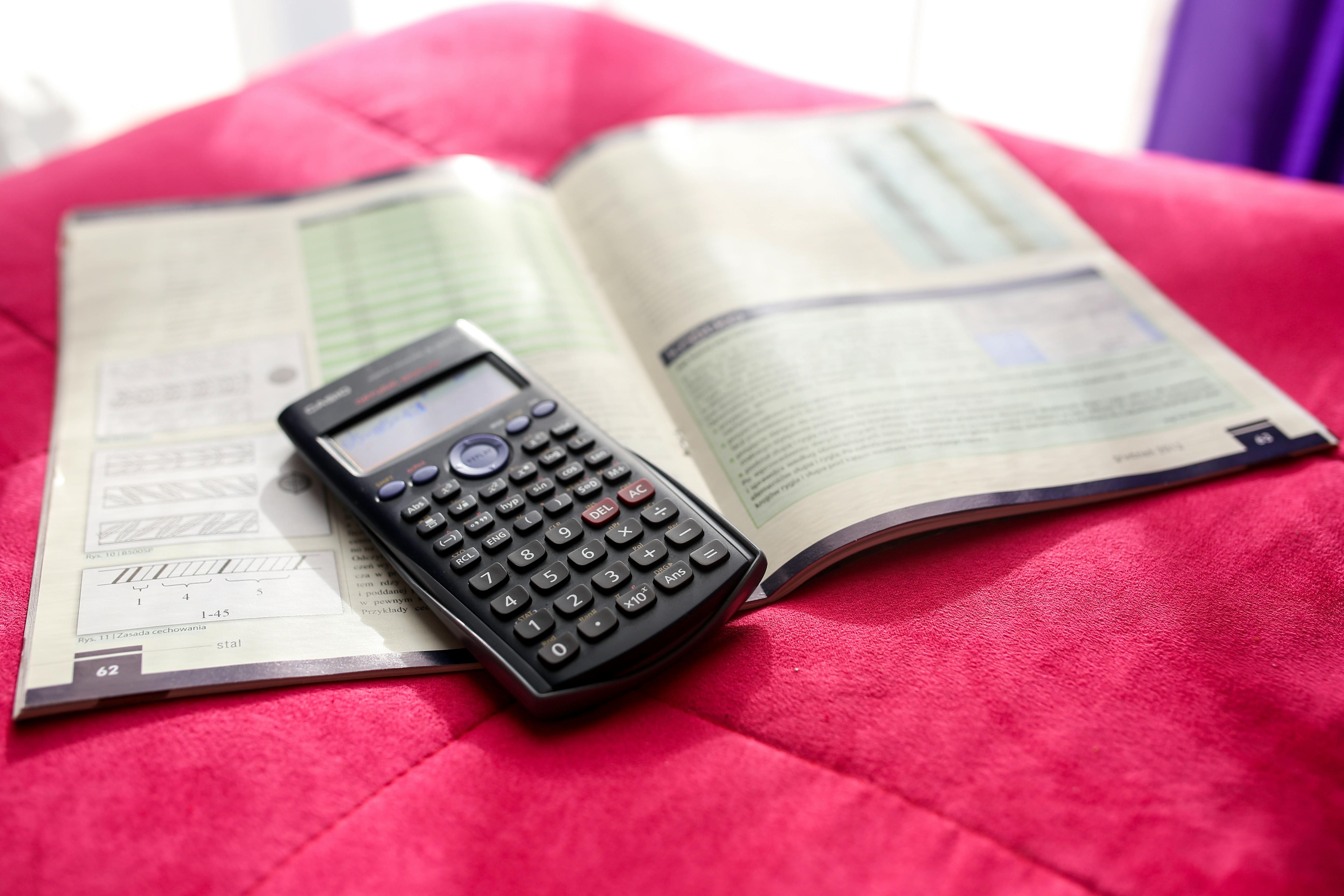 Black Calculator Near Ballpoint Pen on White Printed Paper \u00b7 Free Stock ...