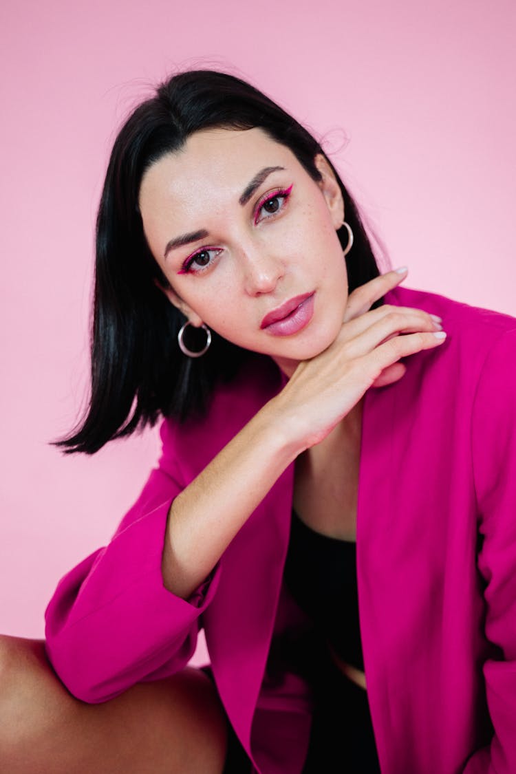 Beautiful Woman Wearing Pink Blazer On Pink Background