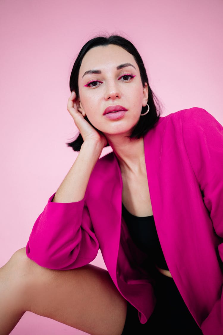 Beautiful Woman Wearing Pink Blazer On Pink Background