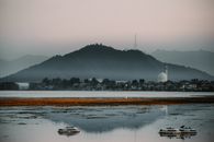 Silhouette of Mountains Near the Body of Water