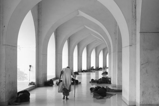 Men Lying on the Ground in Baitul Mukarram
